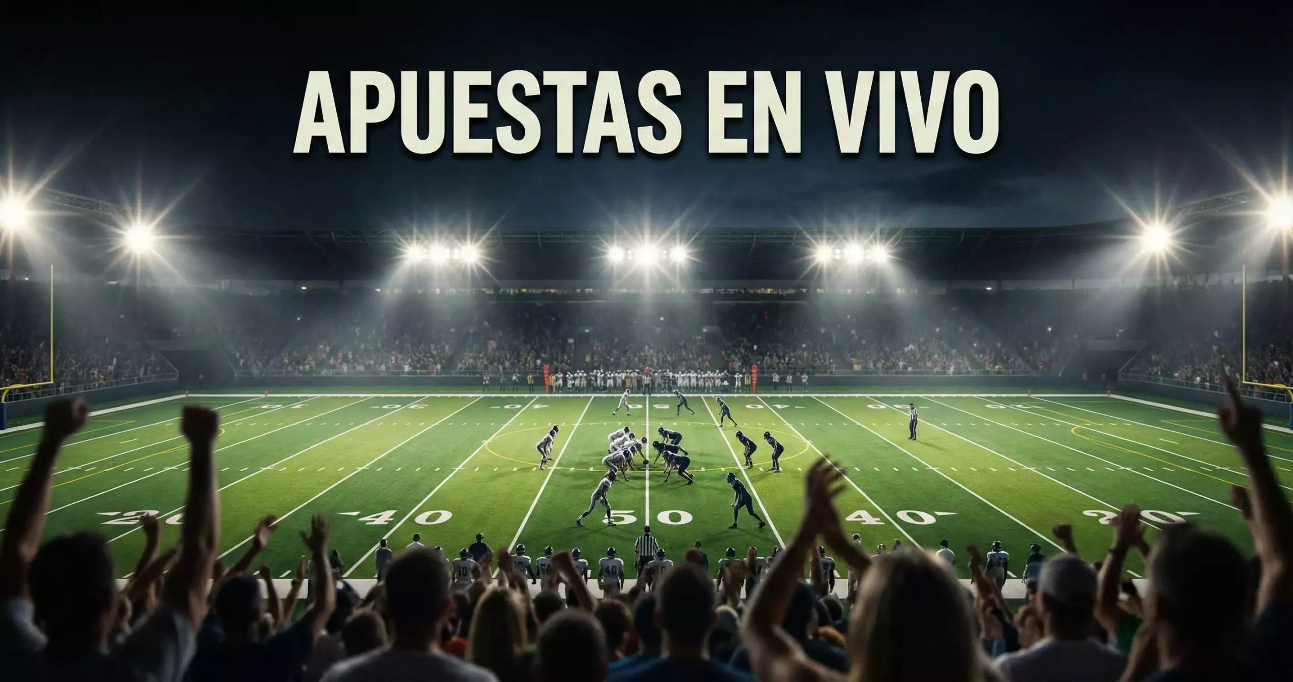Aficionados viendo un partido de fútbol americano en un estadio con las luces encendidas por la noche